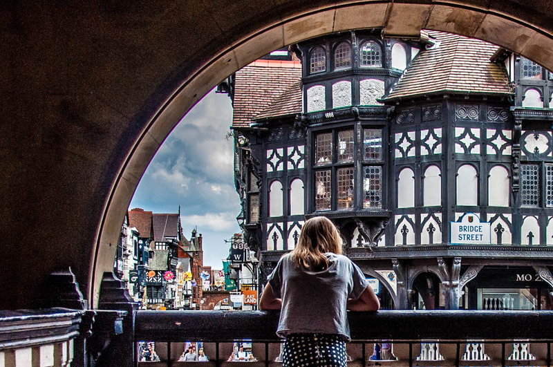 Woman looking out over Chester from The Rows